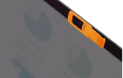 orange camera blocker on a laptop
