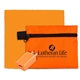 aerial view a orange tech hom and travel kit with microfiber cleaning cloth and us wall charger in polyester zipper kit, image 1 of 2