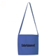aerial view a blue orangebag 12 oz royal blue cotton canvas messenger tote bag, shoulder strap handle, image 1 of 2