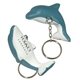 a gray/white squishy dolphin key chain - stress relievers