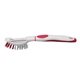 a white with red trim brush - up vegetable brush peeler