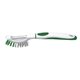 a white with green trim brush - up vegetable brush peeler