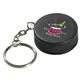 aerial view a black hockey puck key chain - stress reliever, image 1 of 2