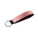 aerial view a rose gold metallic neoprene wrist strap key holder, image 1 of 2