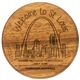 aerial view a wood wood bottle opener round with metal jaw on back, image 1 of 4