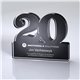 a clear with black back freestanding 20 year anniversary award