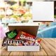 aerial view a white candy craving assortment box, image 1 of 4