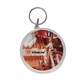 aerial view a clear clear round maze puzzle keychain, image 1 of 3