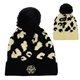 a group of leopard print pom beanie