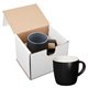 aerial view a black-white 12oz riviera ceramic mug in mailer, image 1 of 2