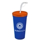 a translucent orange lid & royal blue cup 24 oz stadium tumbler cup with flex straw and lid