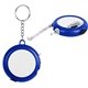 aerial view a white with royal blue multi - tool tape measure with light, image 1 of 2