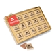 a gold fifteen piece chocolate foiled square box