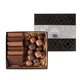 a black cookie and confection gift box with sea salt caramels