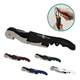 a group of waiters wine opener