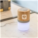 a group of bamboo wireless light up speaker