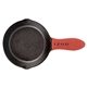 aerial view a black cast iron lodge(r) skillet with silicone custom handle, image 1 of 2