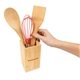 a group of eco - friendly bamboo kitchen utensil holder