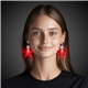 a group of red star led clip on earrings