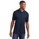 aerial view a deep navy embroidered port company(r) core blend jersey knit pocket polo, image 1 of 5
