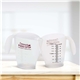 a group of plastic 16 oz measure cup