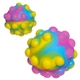 aerial view a rainbow push pop bounce ball, image 1 of 2