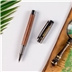 a group of luxwood rollerball rosewood pen