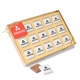 a white fifteen piece chocolate foiled square box