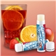 aerial view a tropical punch promotional lip balm with natural beeswax formula, image 1 of 2