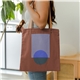 aerial view a group of main squeeze - colored canvas with leather handles, image 1 of 3