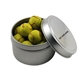 a silver round tin with chocolate tennis balls