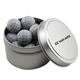 a silver round tin with chocolate golf balls