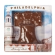 aerial view a group of 4.5 oz chocolate molded liberty bell, image 1 of 2