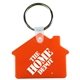 a translucent orange 2-1/16 w x 1-5/8 h plastic house shaped key fob