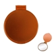 aerial view a translucent orange round compact mirror, image 1 of 3