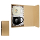 a brown box with white crinkle paper box & black and white mug kootenay kit brown