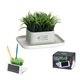 a white kikkerland potted pen phone stand