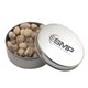 a silver round tin with pistachios