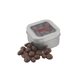 a silver window tin with choc raisins