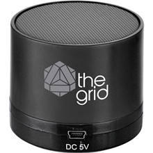 aerial view a black cylinder bluetooth speaker, image 1 of 3