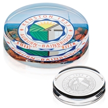 a group of round crystal paperweight