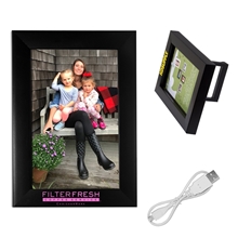 aerial view a black wireless speaker and picture frame, image 1 of 2