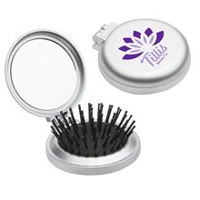 aerial view a silver travel disk brush mirror, image 1 of 3