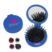 a group of brush and mirror compact