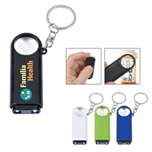 a group of magnifier and led light key chain