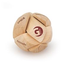 aerial view a brown round shaped wooden puzzle, image 1 of 2
