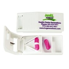 a white 2 compartment pill box and cutter
