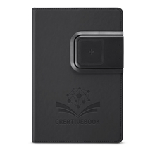 aerial view a black refillable journal with wireless charging panel, image 1 of 10