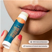 aerial view a group of promotional lip balm with natural beeswax formula, image 1 of 5