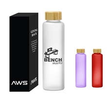 a group of 20 oz aws belle glass bottle with bamboo lid